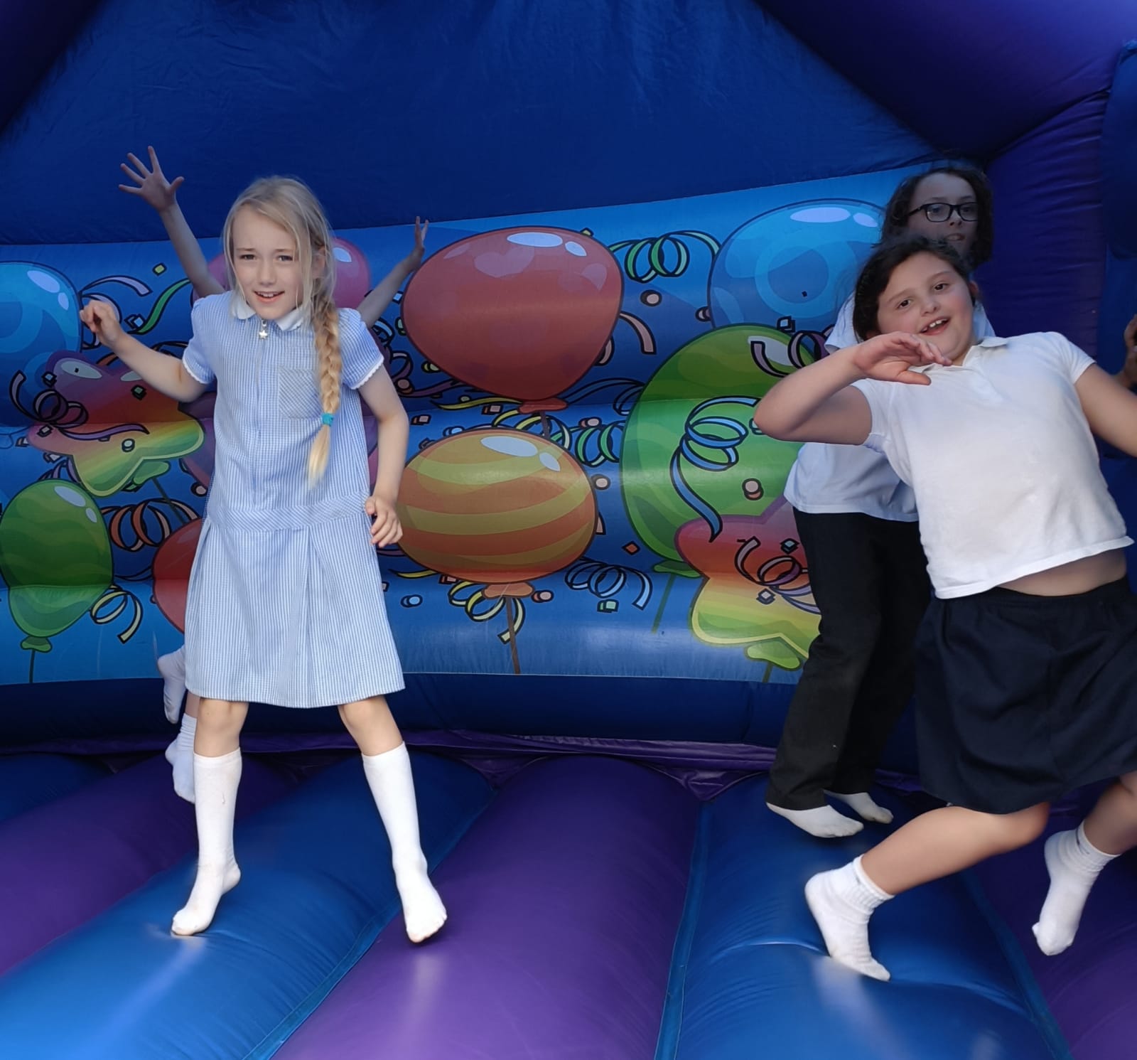 children on a bouncy castle