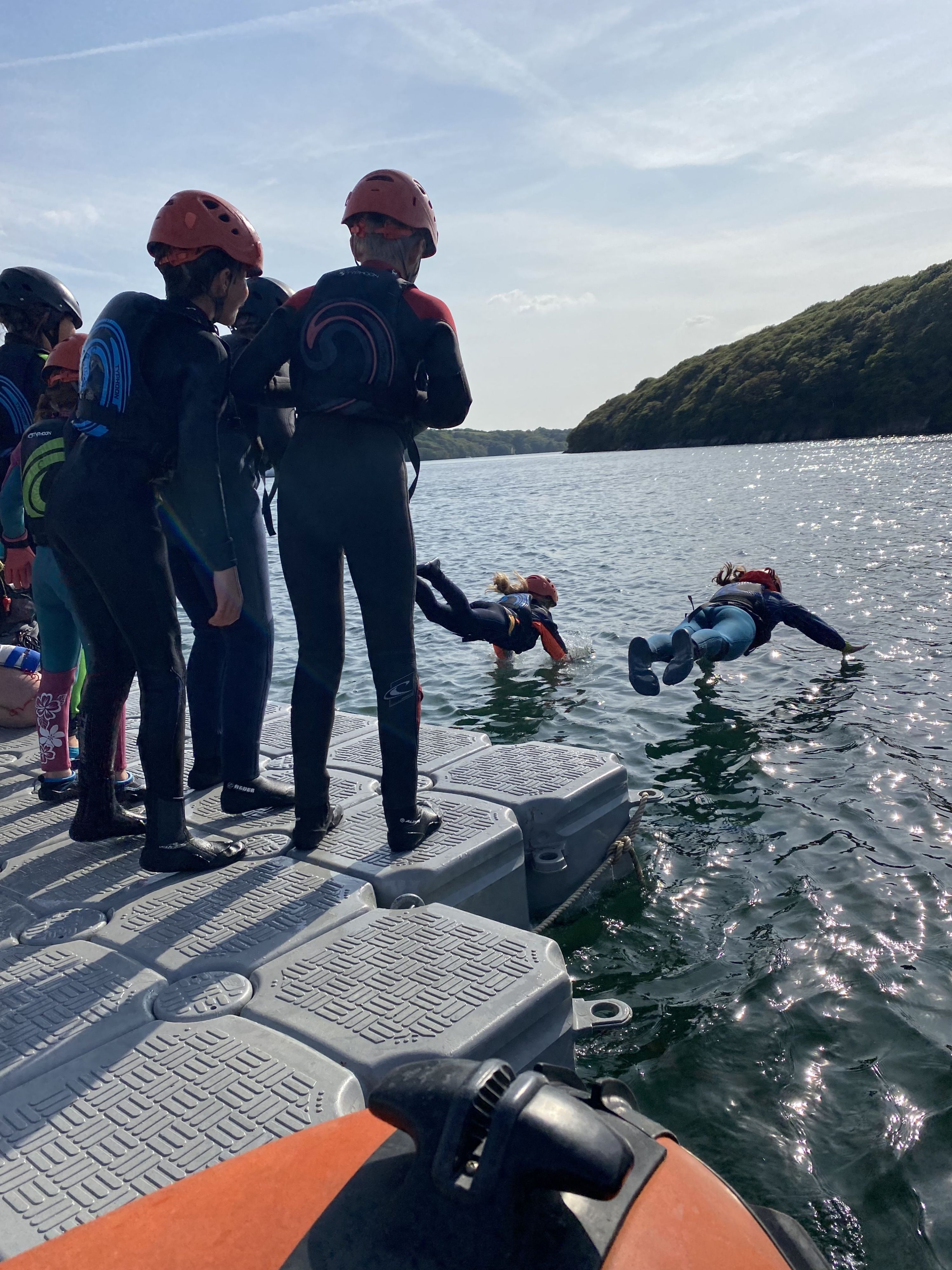 Children diving into the lake