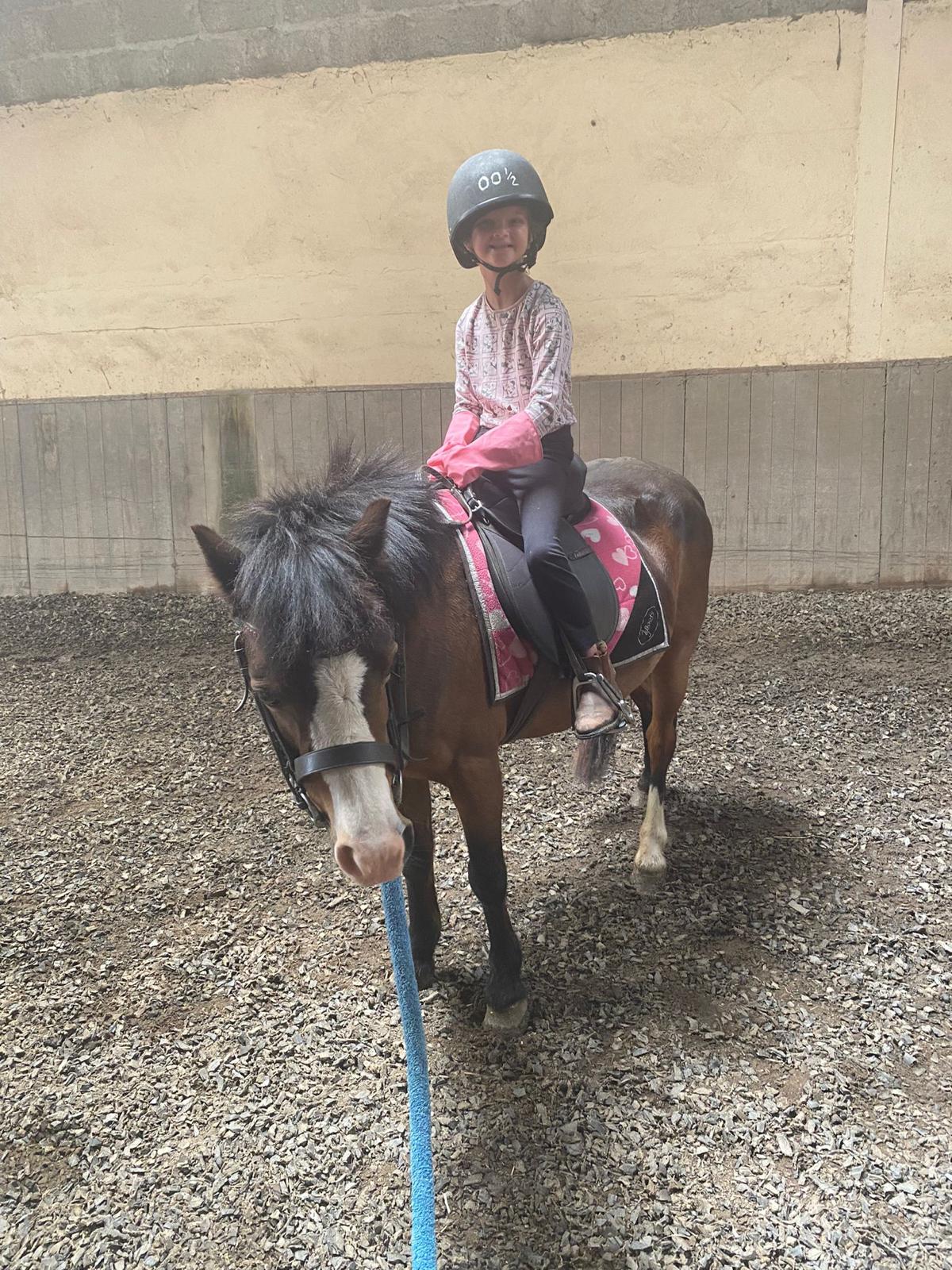 chiold on a horse