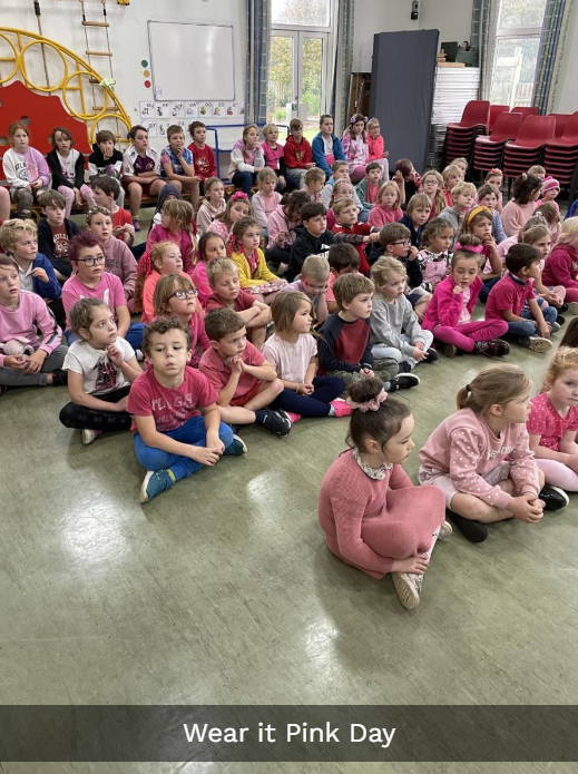 Children sitting in rows during assembly